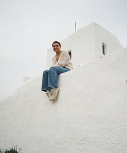 A person sitting on a wall