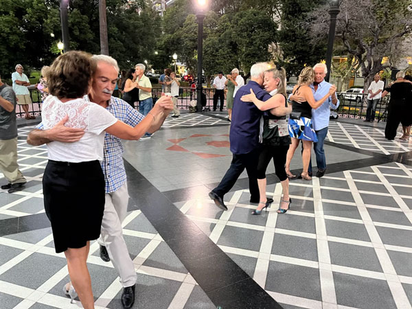 A group of people dancing in a square