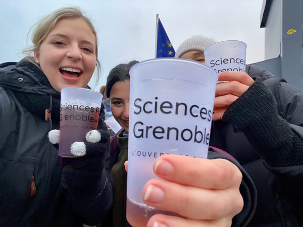 A group of study abroad students holding cups