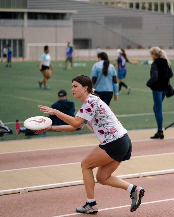 A study abroad student throwing a frisbee