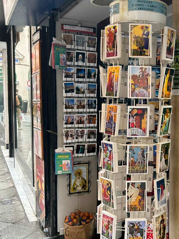 A storefront with postcards and pictures