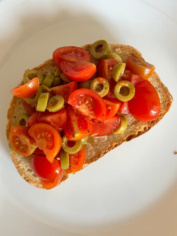 Homemade fresh tomato and olive tapenade toast