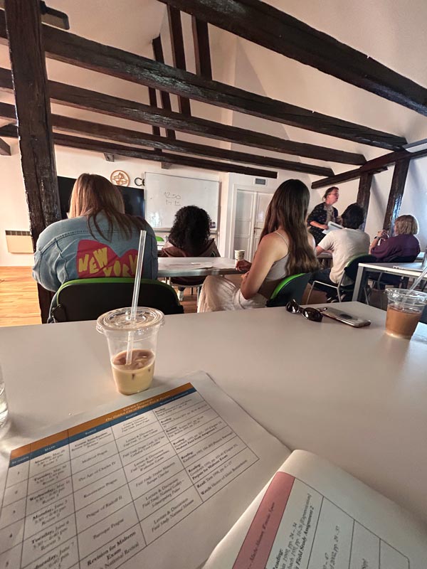 A classroom with study abroad students sitting in rows looking toward the front