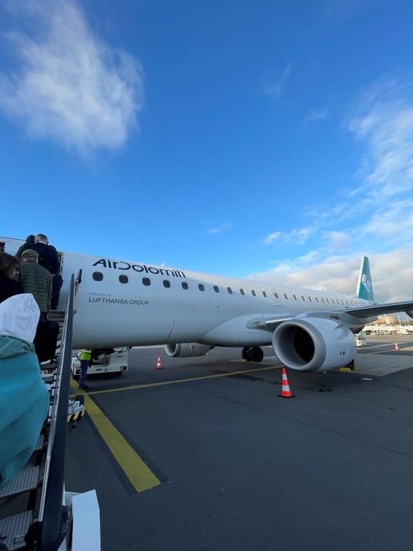 Photo of people boarding a AirDolomiti flight
