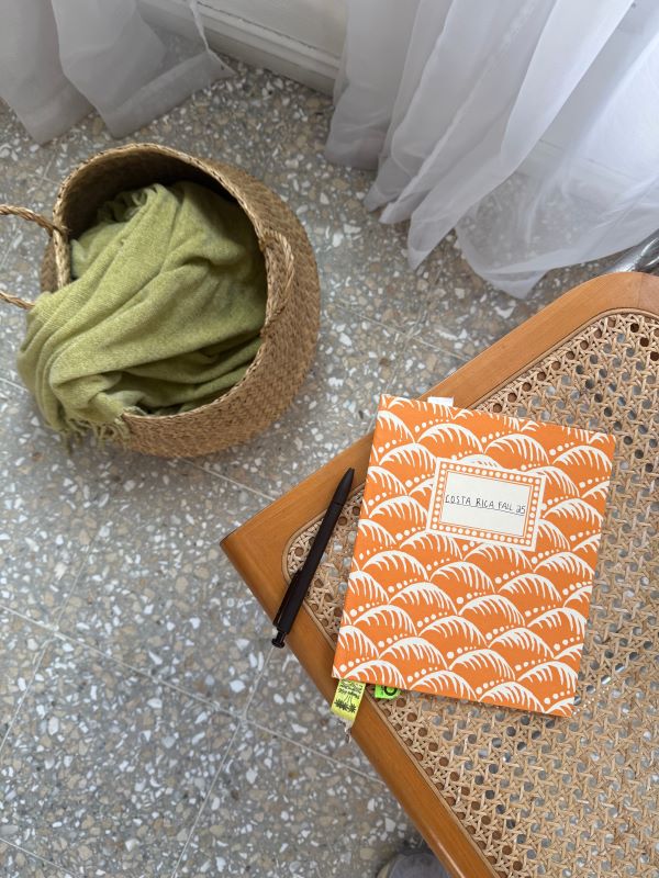 An orange journal with the words
