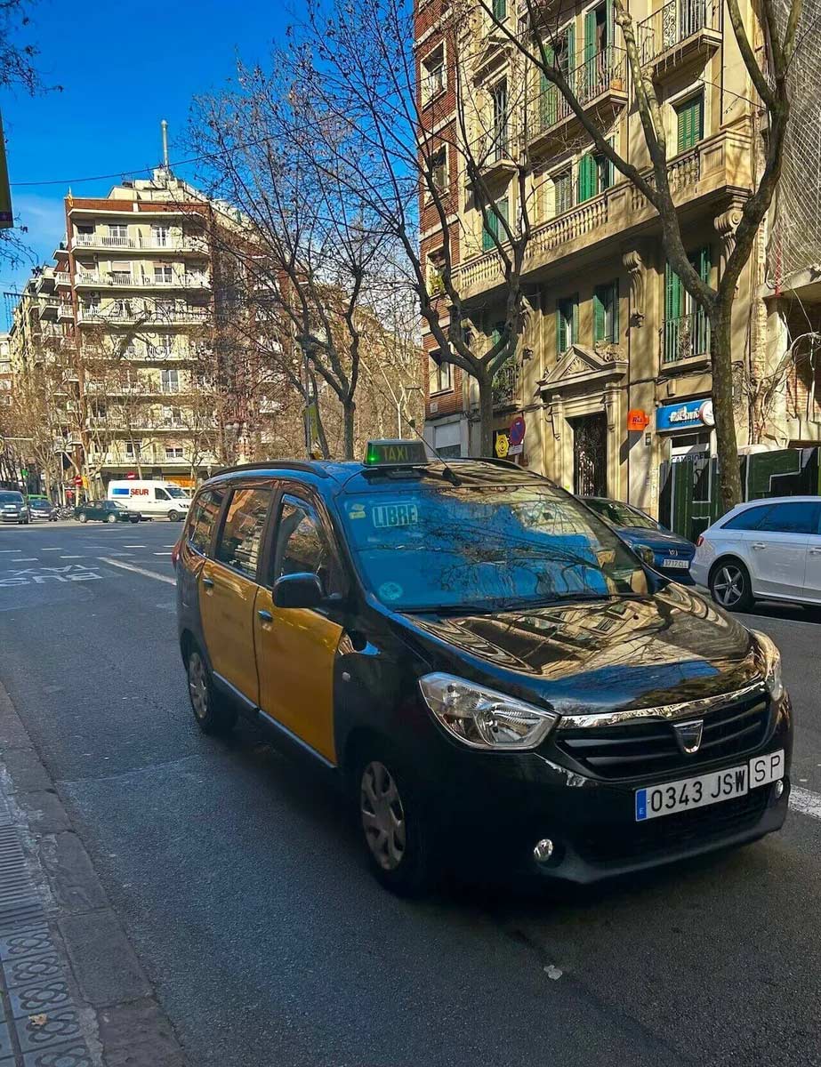 Black and yellow taxi in Barcelona, Spain