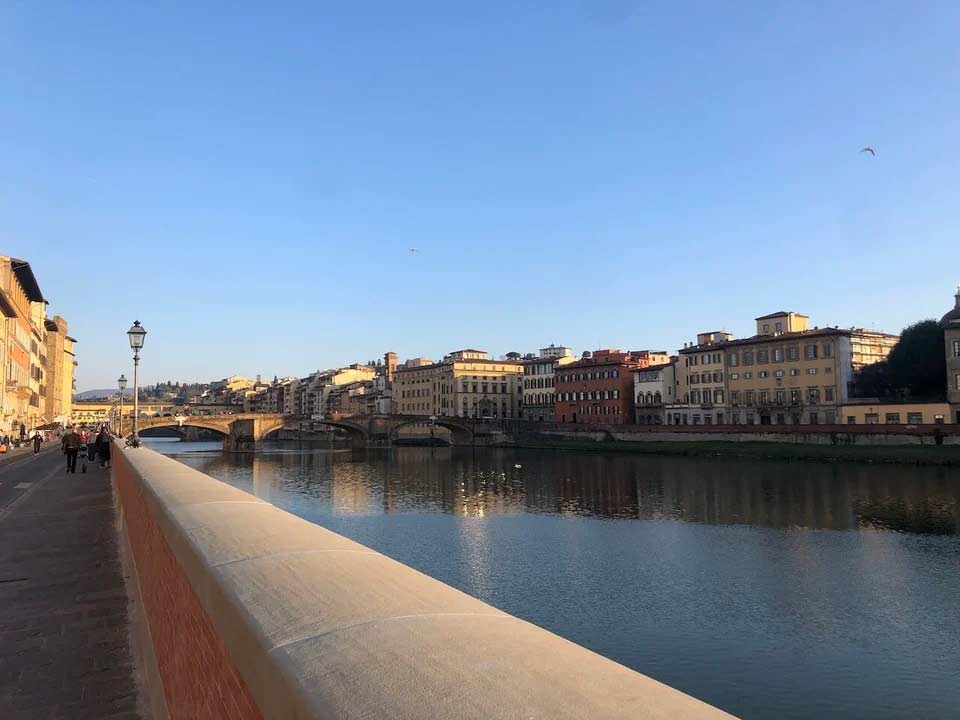 StudyAbroad_Spring2022_Florence_Chris_Reidy_Catching_Some_Vitamin_D_on_the_Arno_After_a_Week_Inside