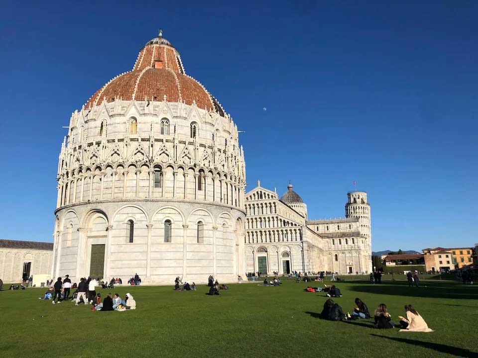 StudyAbroad_Spring2022_Florence_Chris_Reidy_Lounging_on_the_lawn_in_Pisa