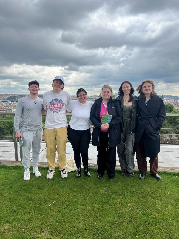 Six study abroad students posing for photo during field trip 