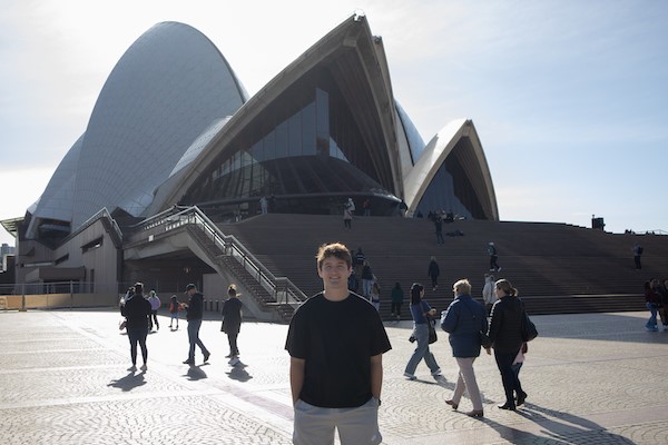 Person standing in front of Sydney Opera House