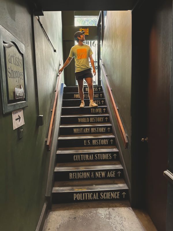 Study abroad student posing for photo on staircase