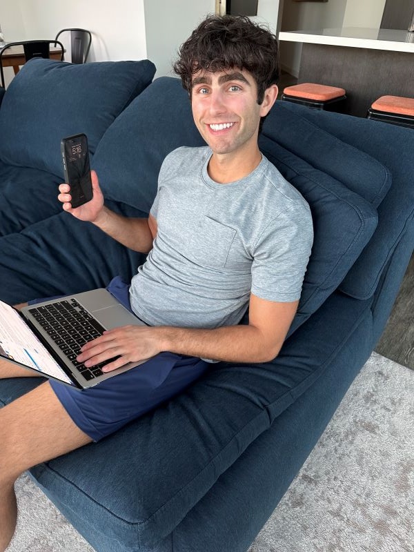 Study abroad alumni working from home on couch