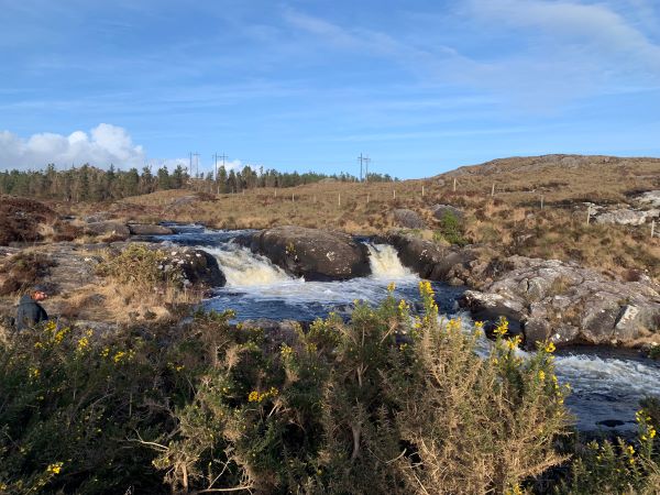 Photo of river with two connecting waterfalls
