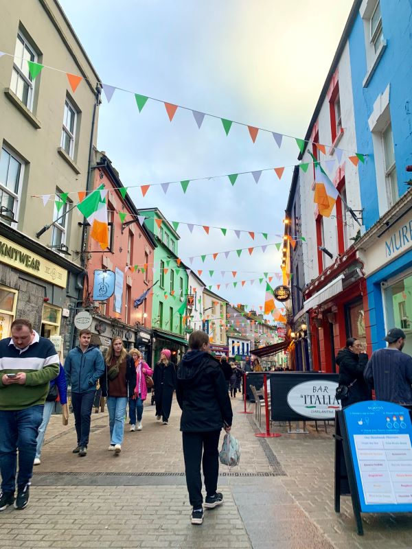 Photo of the Latin Quarter in Galway with people roaming street lined with shops