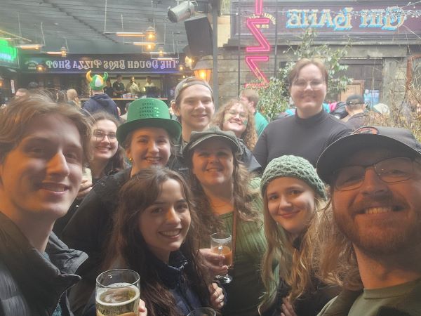 Selfie of study abroad students celebrating St. Patty's Day at a pub