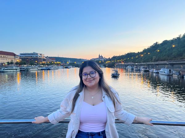 Study abroad student posing for photo on boat in the Vltava River