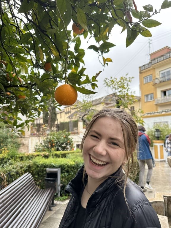 a study abroad student smiling at the camera
